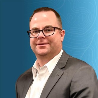 Headshot of Chad Pulley on a blue topographic background