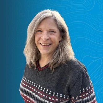 headshot of Janet Guinn, Principal Planning Team Lead, on a blue background
