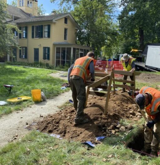 Field technicians perform archaeological excavations behind Emily Dickinson's Homestead.