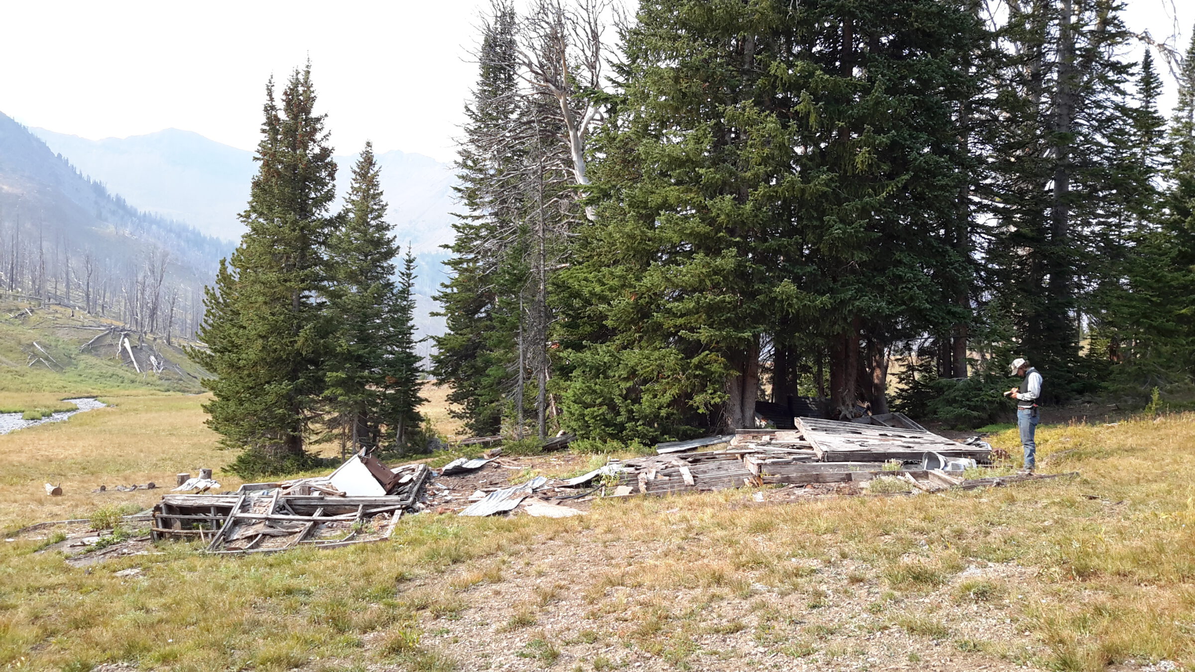 An archaeologist conducts cultural resource surveys for an abandoned mine reclamation project in the Absaroka Mountain Range in Park County, Wyoming.
