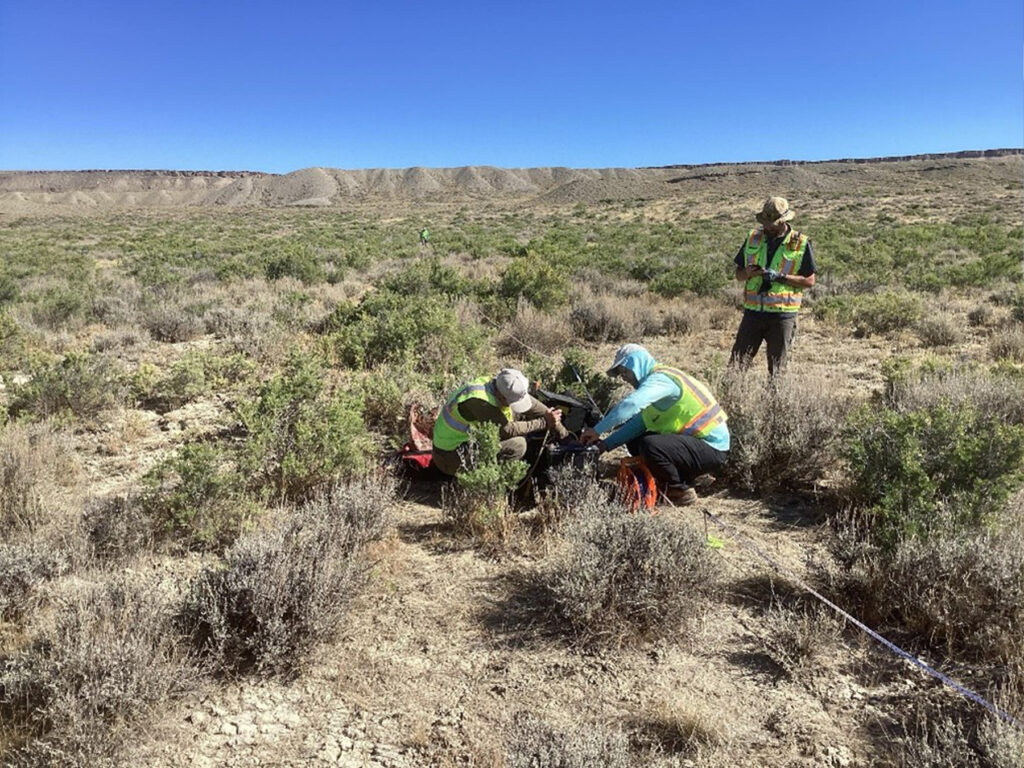 Terracon geophysical data collection team deploying equipment at the WY ground electrode site.