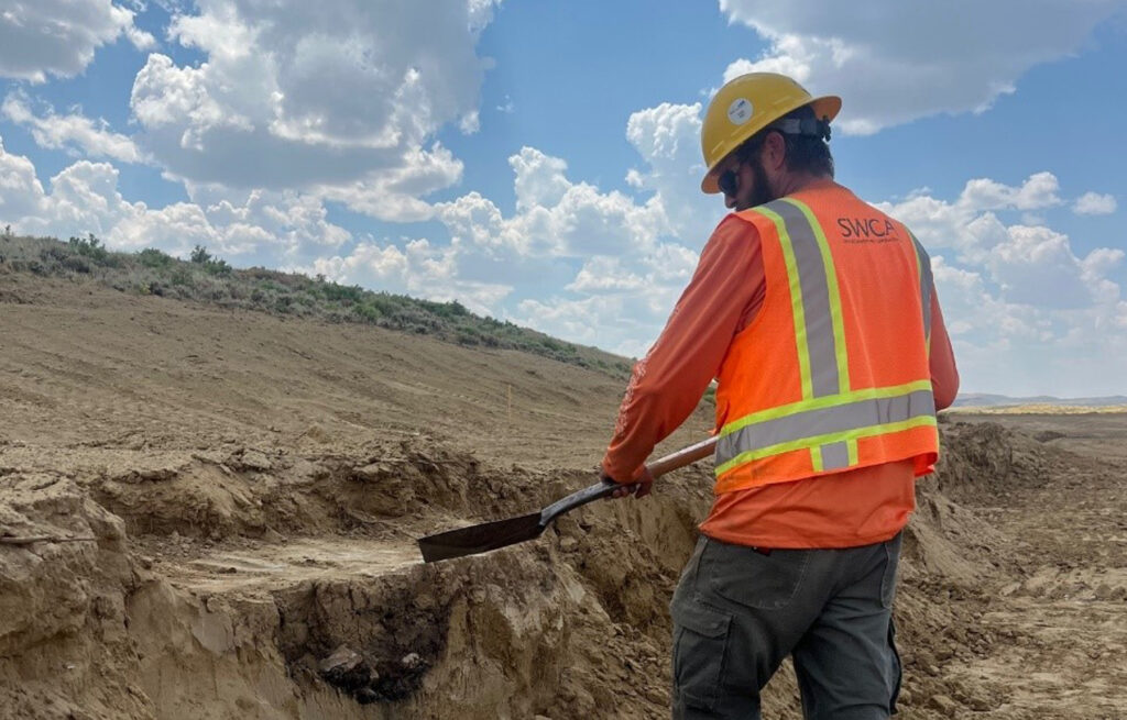 Wyoming Terminal: SWCA employee excavating a recently discovered earth oven feature found during cultural resource construction monitoring in July 2024.