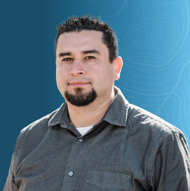 Headshot of Nelson Augilar on a blue topographic background