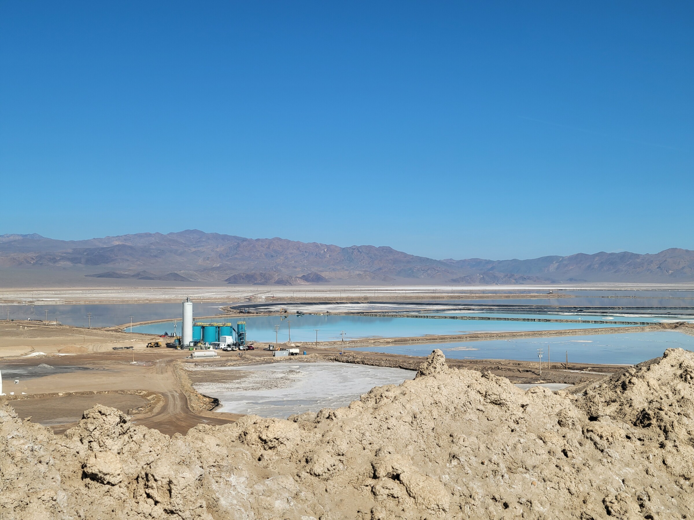 View from on top of a salt storage pile overlooks evaporation ponds and processing facilities.