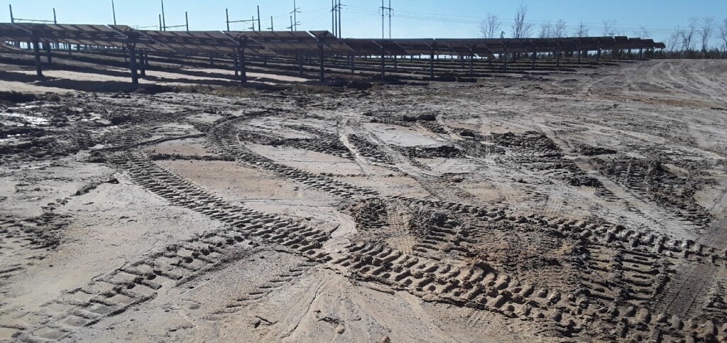 Ongoing rain made for a muddy site with solar panels shown. 