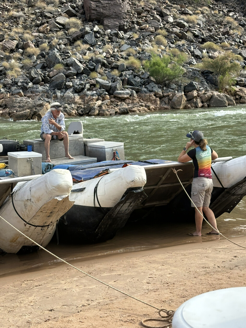 Michelle Weigman and Steve Carothers near a rafting boat in the Grand Canyon. 