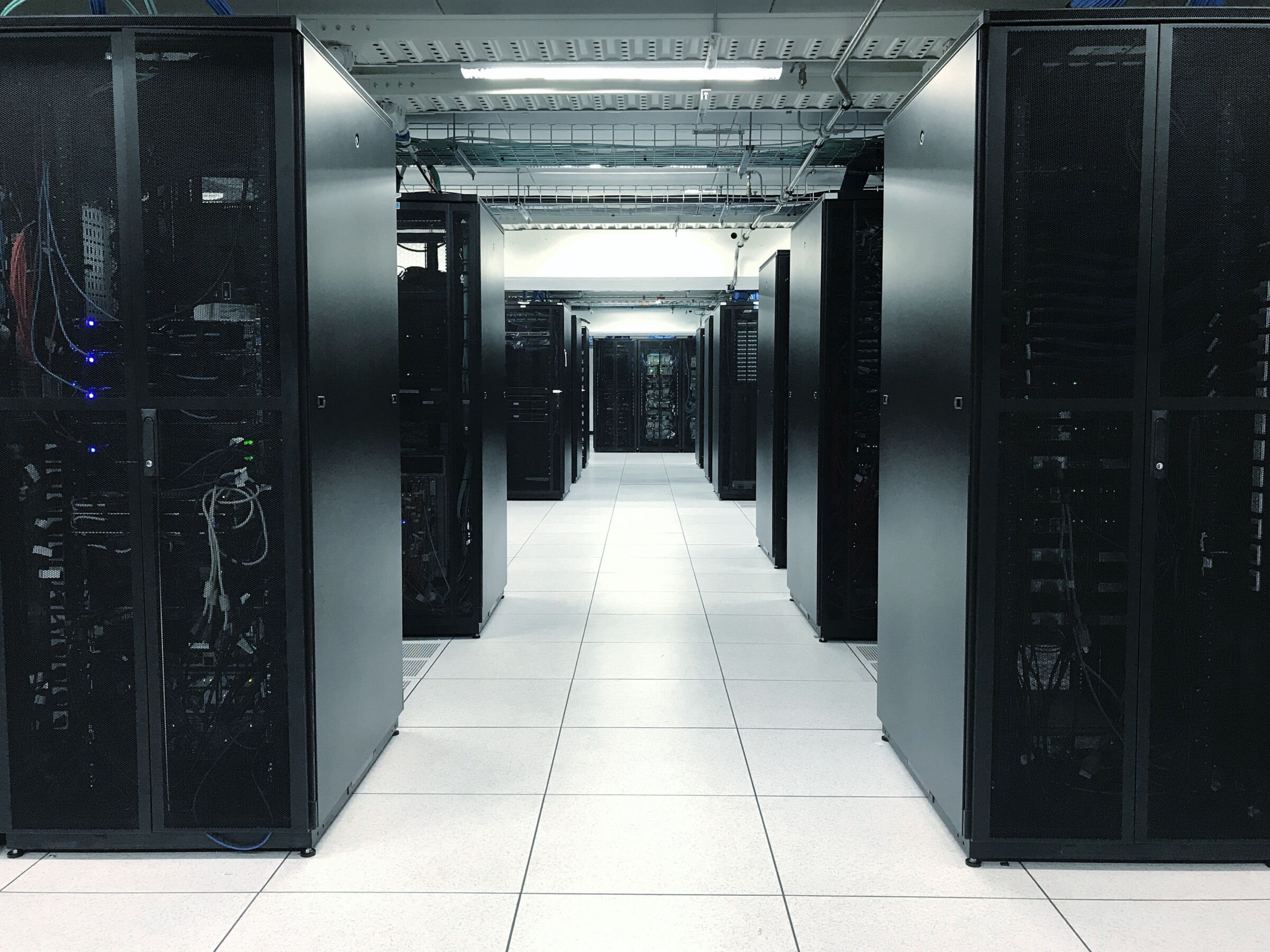 row of server racks or network device racks in data center